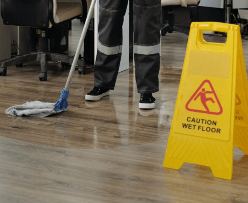 Cleaning a wooden floor using wet mop